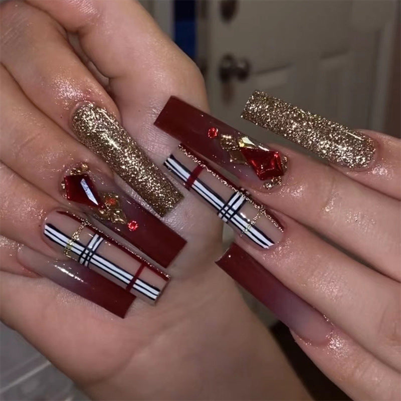 Glamorous stiletto nails with extravagant design and glitter accents Kalsten