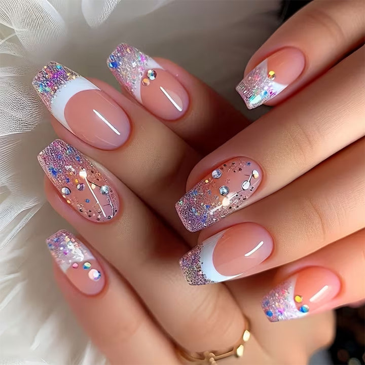 Glamorous artificial nails with glitter and rhinestone embellishments Kalsten