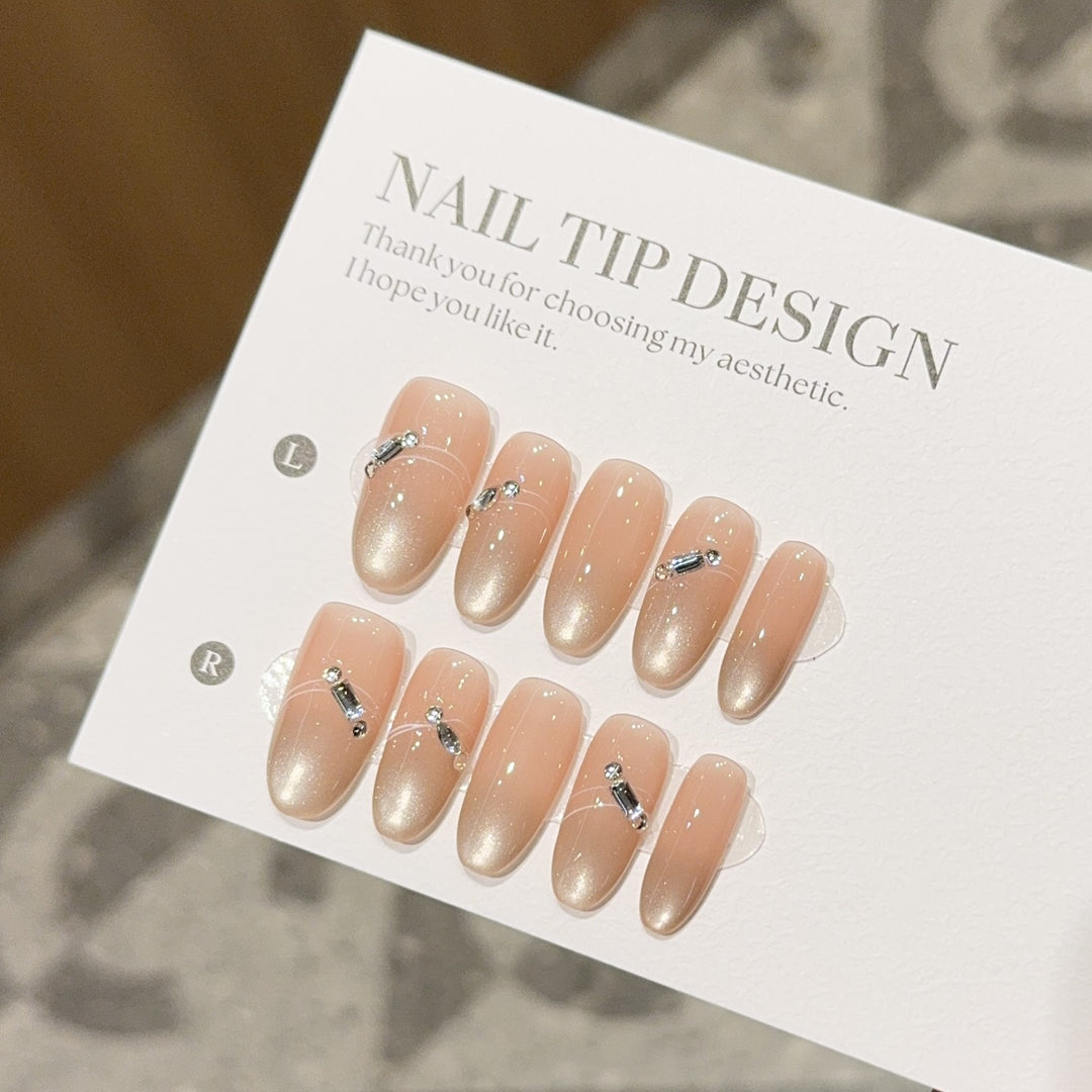 Artificial nail tips with elegant gradient color and rhinestone accents Kalsten