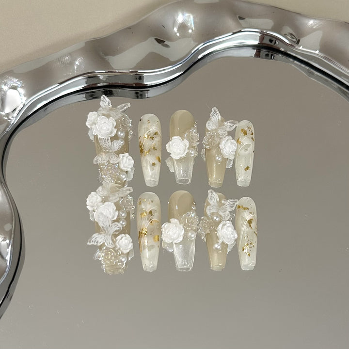 Elegant Press-On Nail Art Set with Floral and Pearl Accents