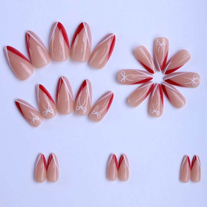 Artificial nails in elegant stiletto design with bow accents Kalsten