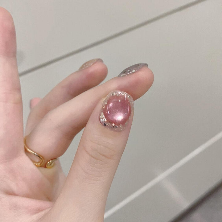 Artificial acrylic nails with shimmering effects and elegant glitter accents Kalsten