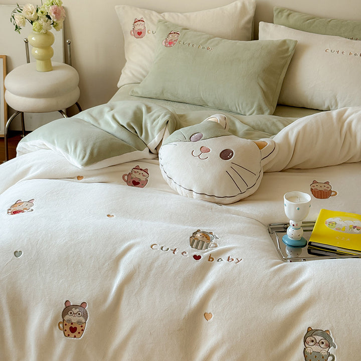 Cute children's bedding set made of soft cotton terry with embroidered cat appliqués and cuddly plush pillow.