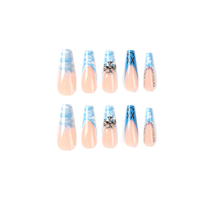 Artistic acrylic nails with marbled design and unique embellishments Kalsten