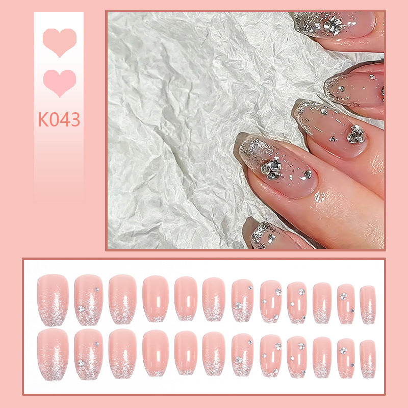 Acrylic nail set with extravagant glitter and crystal embellishments Kalsten
