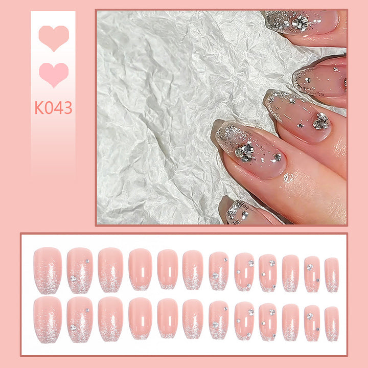 Acrylic nail set with extravagant glitter and crystal embellishments Kalsten