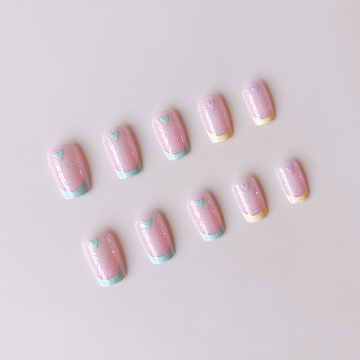Artificial nail set with playful color gradients and heart motifs Kalsten