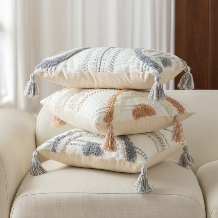 Woven decorative cushion cover with semi-circular tuft appliqué, fringe tassels, and concealed zipper Kalsten