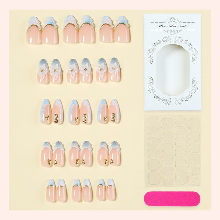 Creative nail set with elegant gold embellishments Kalsten