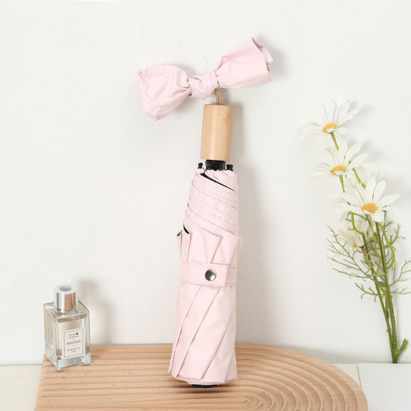 Ladies compact folding umbrella with elegant design and ergonomic wooden handle Kalsten