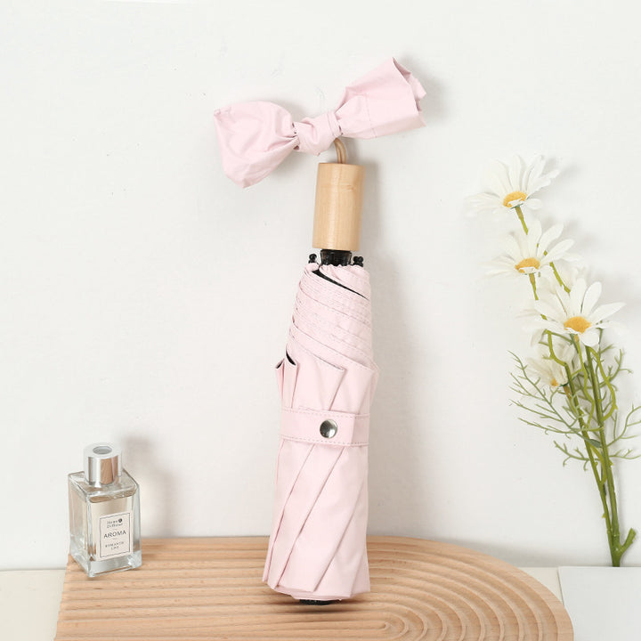 Ladies compact folding umbrella with elegant design and ergonomic wooden handle Kalsten