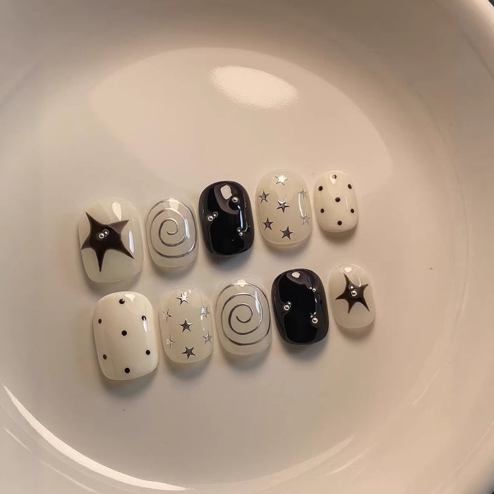 Artistic Press-On Nail Set with Star and Swirl Designs
