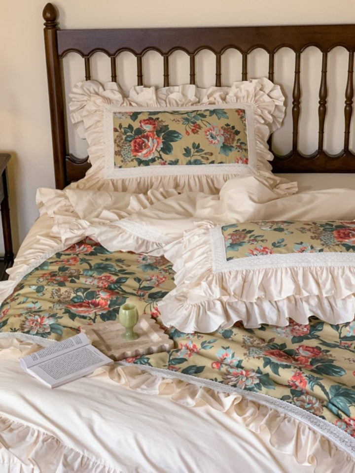Romantic bedding set with ruffles, floral inserts and decorative pillowcase
