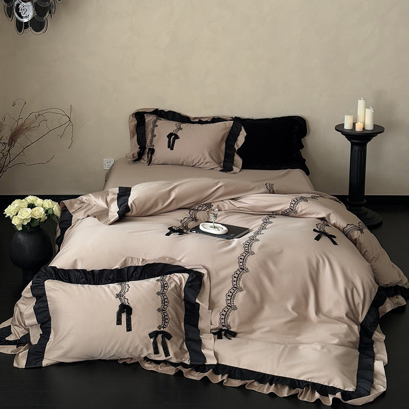 Luxurious satin bedding set with ruffles, lace embroidery and decorative bows