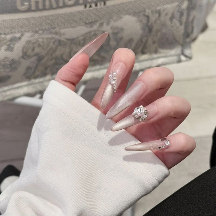 Acrylic nail set with elegant tips and glamorous rhinestone accents Kalsten