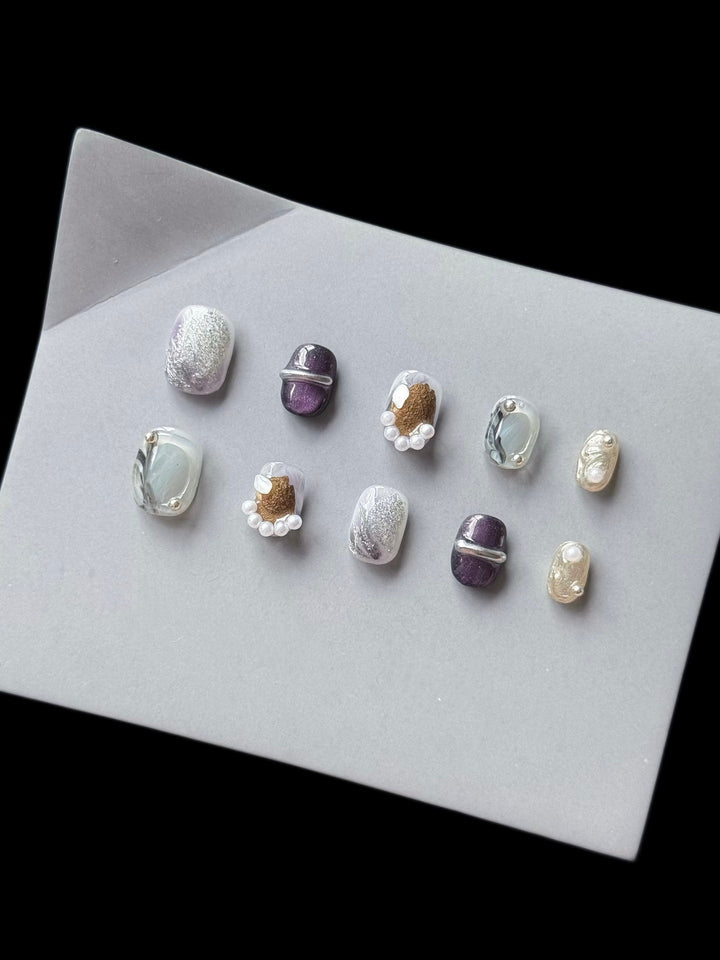Artistic Press-On Nail Art Set with Unique Textures and Pearl Accents