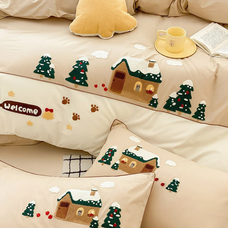 Cozy bedding set with embroidered winter house and Christmas tree motifs
