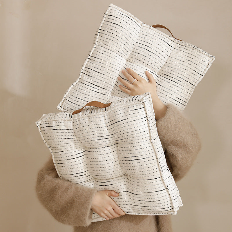 Padded square seat and floor cushion with quilted tufted padding and carrying handle Kalsten