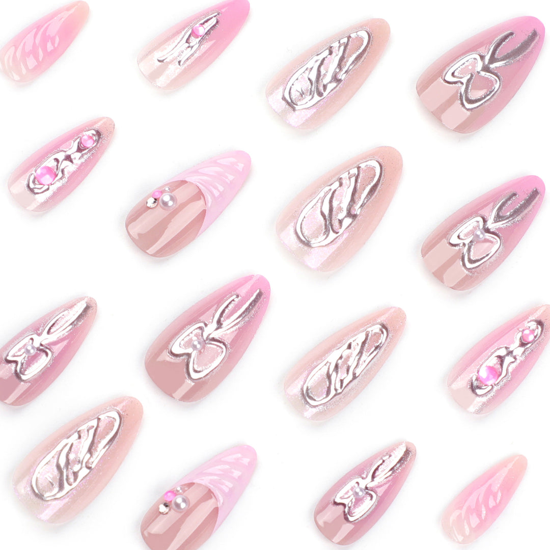 Artful stiletto nails with glitter and pearl decorations Kalsten