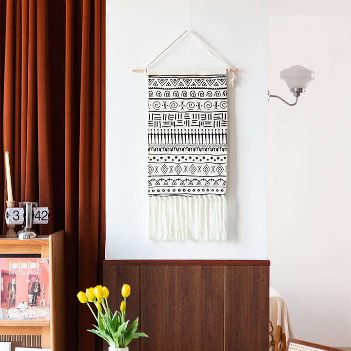 Woven cotton blend wall hanging with graphic ethnic pattern and long fringes Kalsten