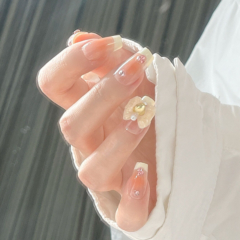 Artificial nail set with elegant floral decorations and glitter accents Kalsten