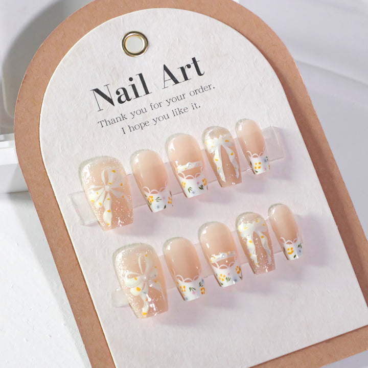 Artful Nail Extensions with Floral Design and Bow Accents Kalsten