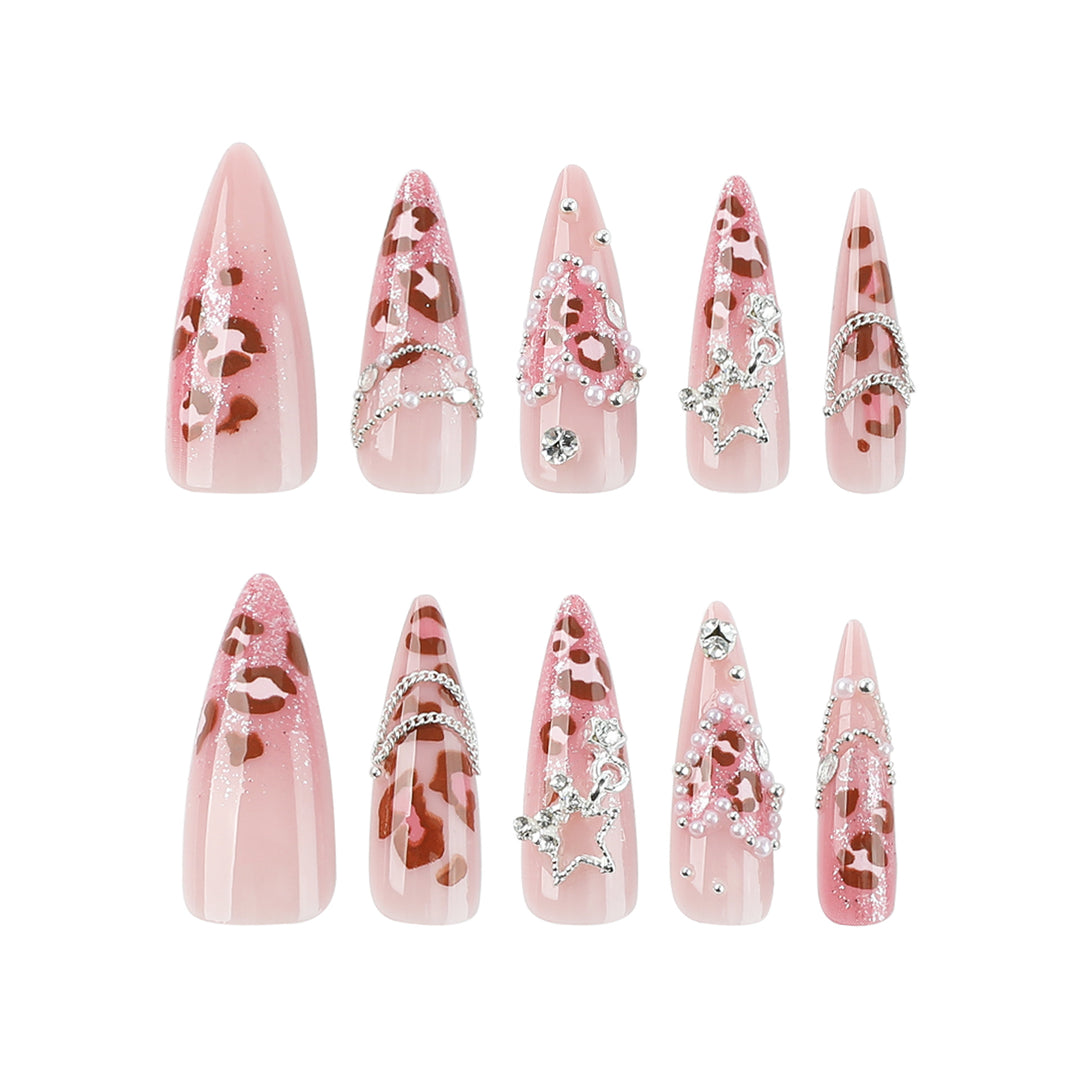 Artistic stiletto nails with glitter and jewelry accents Kalsten