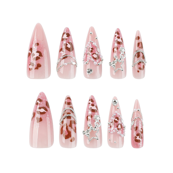 Artistic stiletto nails with glitter and jewelry accents Kalsten