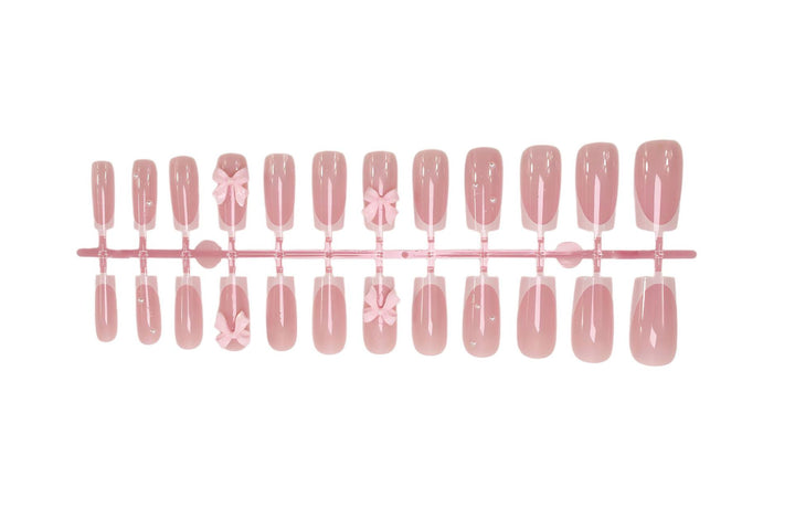 Nail art set with playful ribbon designs and elegant accents Kalsten