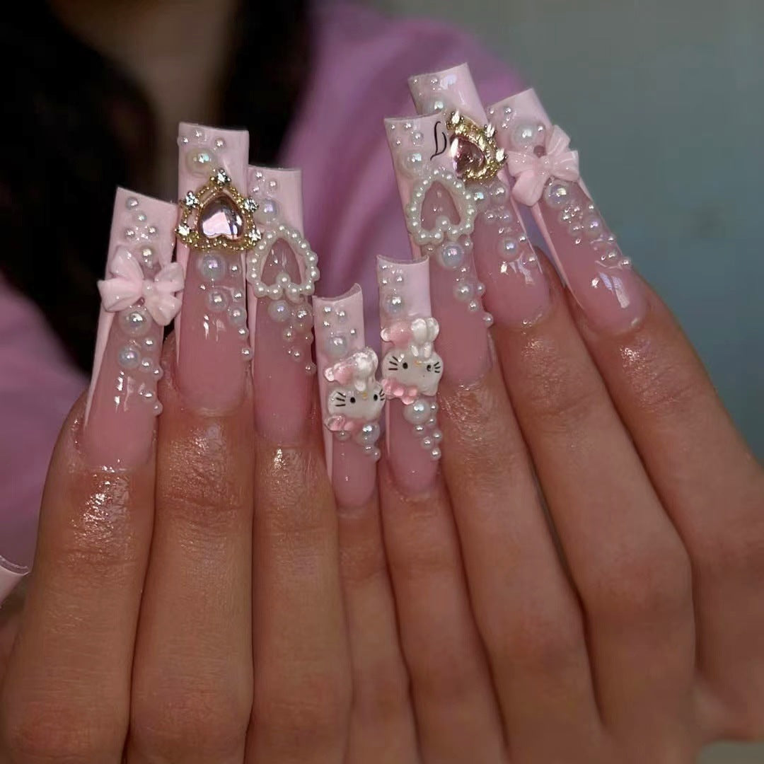 Glamorous artificial nails with 3D decorations and pearl accents Kalsten