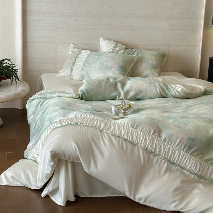 Extra soft satin duvet cover set with voluminous ruffle, subtle watercolor leaf print and concealed closure
