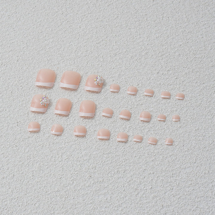 Artificial nail set with elegant French tip design and sparkling accents Kalsten