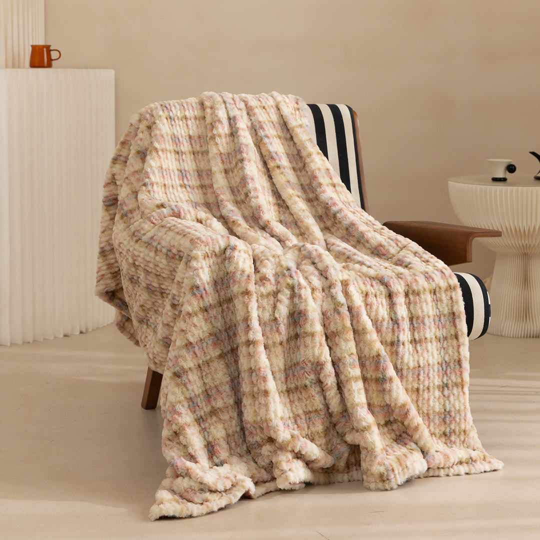 Cozy blanket made of luxurious synthetic fur with wavy texture and soft microfiber back Kalsten