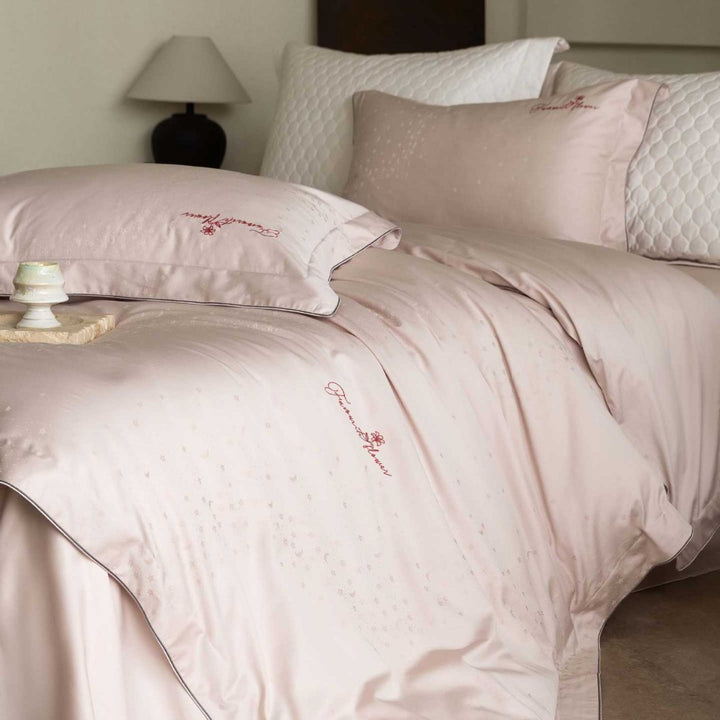 Luxurious satin bedding complete set with quilted cover and delicate logo embroidery