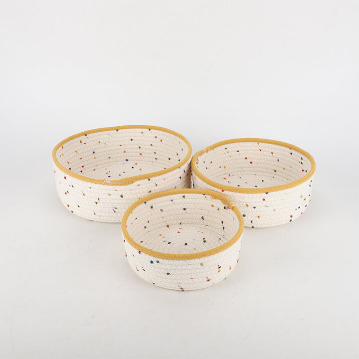 Storage basket made of natural cotton fabric with colorful dots