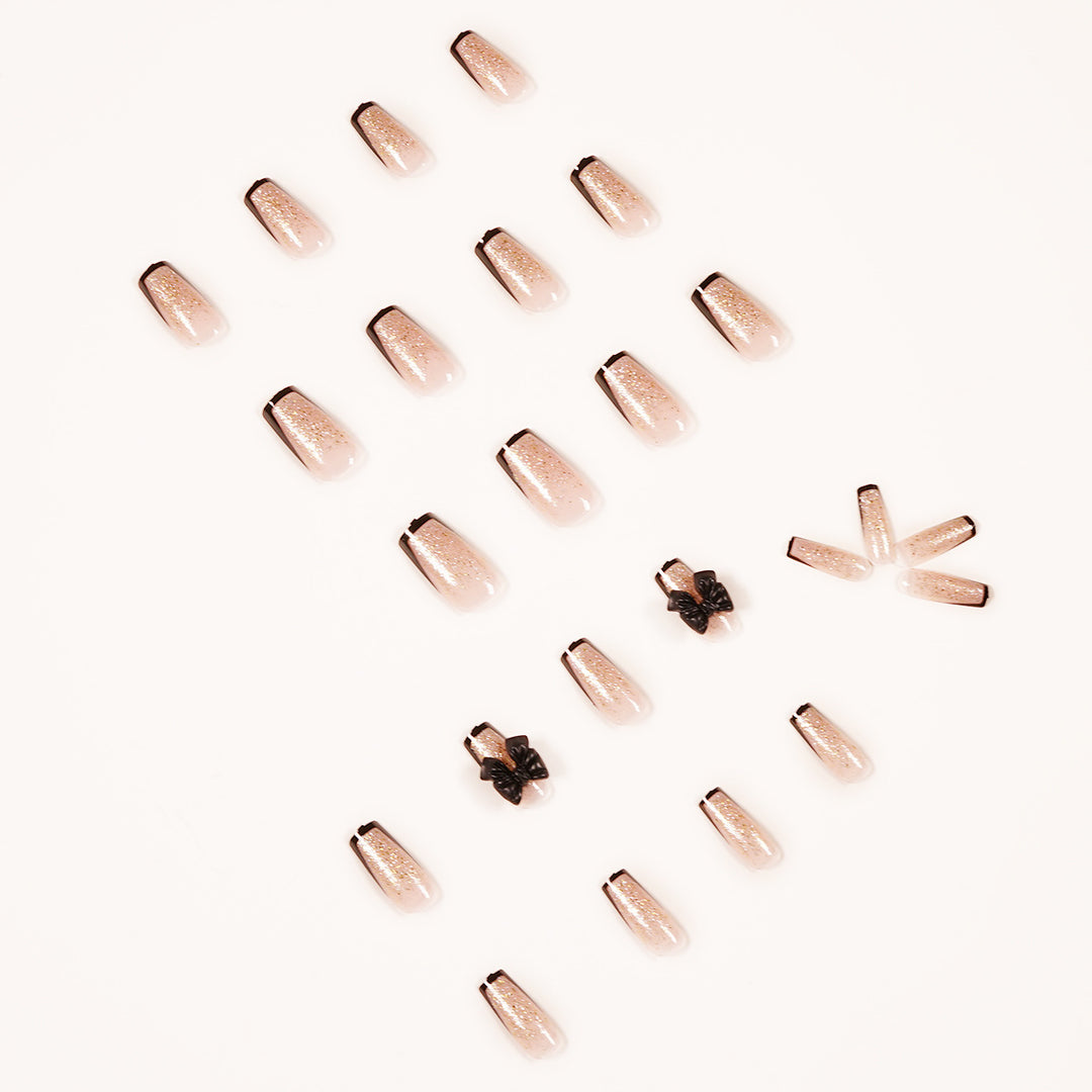 Artistic Nail Extensions with Glitter and Bow Accents Kalsten