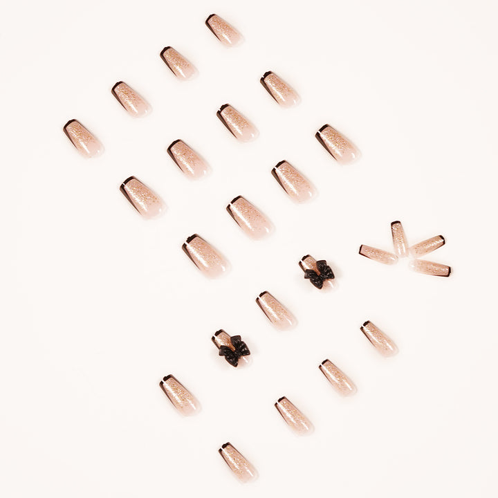 Artistic Nail Extensions with Glitter and Bow Accents Kalsten