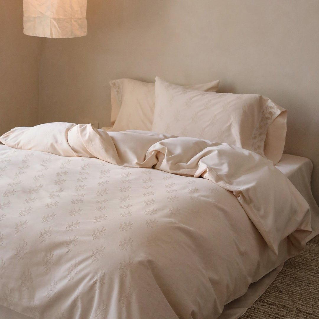 Exclusive cotton satin bedding set with tonal floral jacquard and fine decorative embroidery