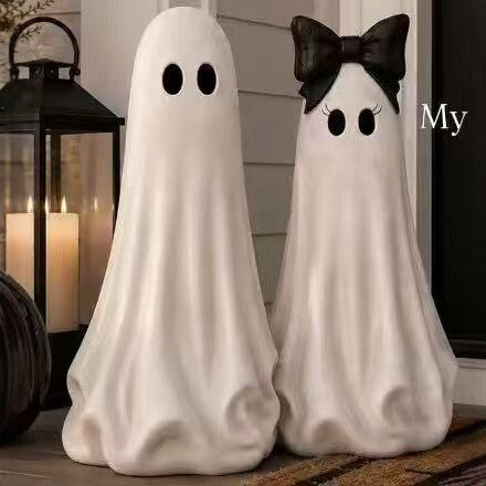 Playful ceramic decorative figure in ghost form with bow detail