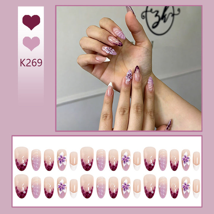 Artificial nail set with elegant ombre design and floral accents Kalsten