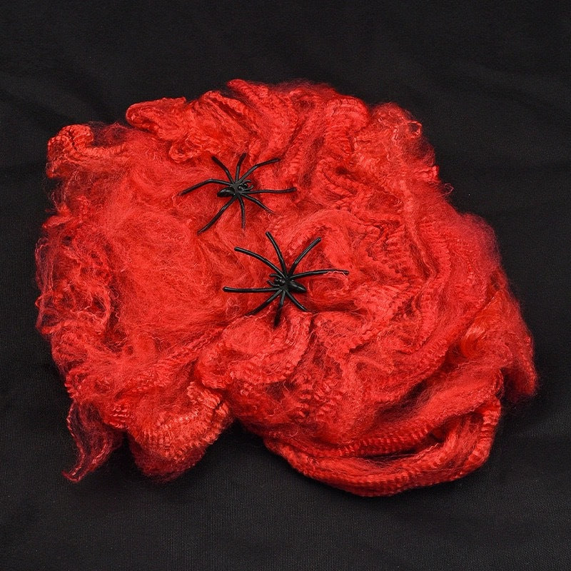 Decorative Halloween spider web with artificial spiders