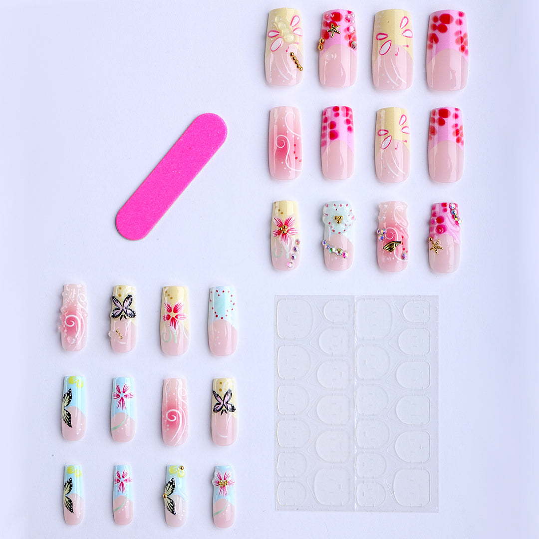 Artistic nails with floral accents and glitter clusters Kalsten