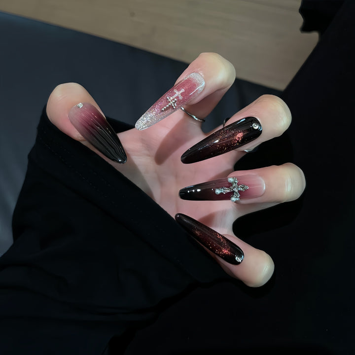 Glamorous artificial nails with shimmering color gradient and cross design Kalsten