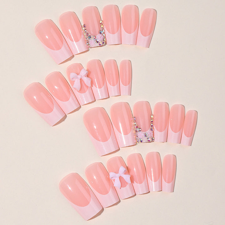 Artifical nail set with glamorous 3D bows and crystal embellishments Kalsten