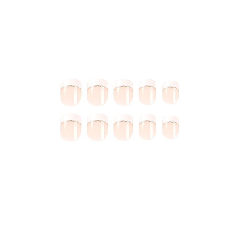 Artful nail extensions with elegant French tip and gold accents Kalsten