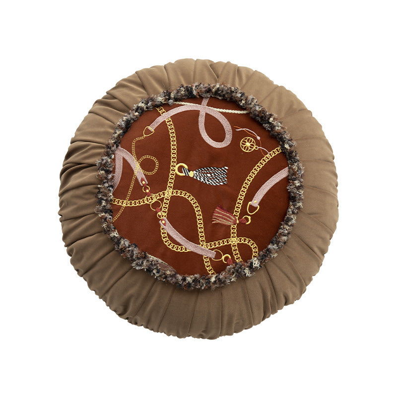 Round decorative pillow with pleated edge, fringe trim, and chain tassel motif Kalsten