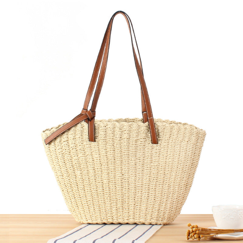 Beach bag made of handwoven natural material with sturdy leather straps Kalsten