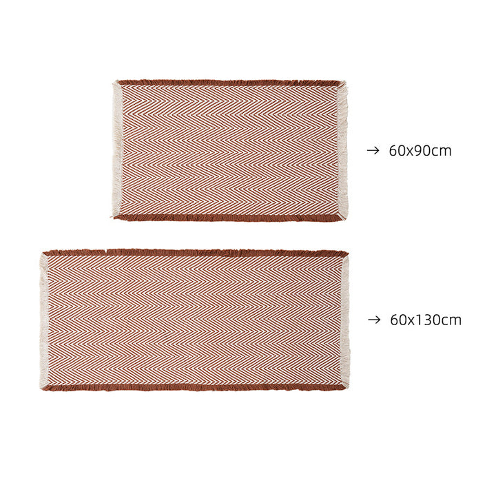 Handwoven cotton bath mat with herringbone pattern and fringes Kalsten