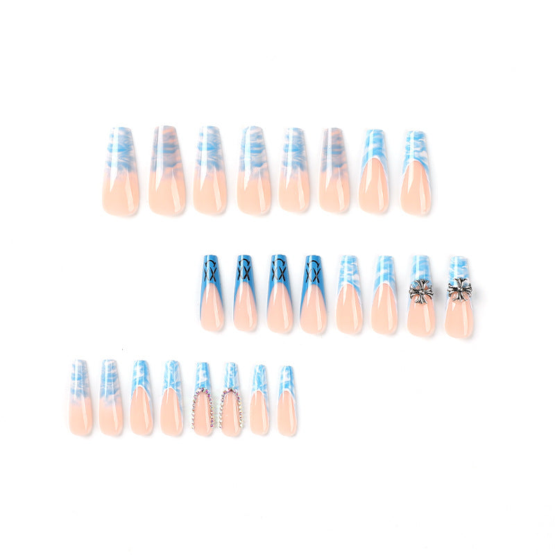 Artistic acrylic nails with marbled design and unique embellishments Kalsten