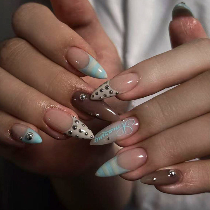 Artificial stiletto nails with glamorous applications Kalsten
